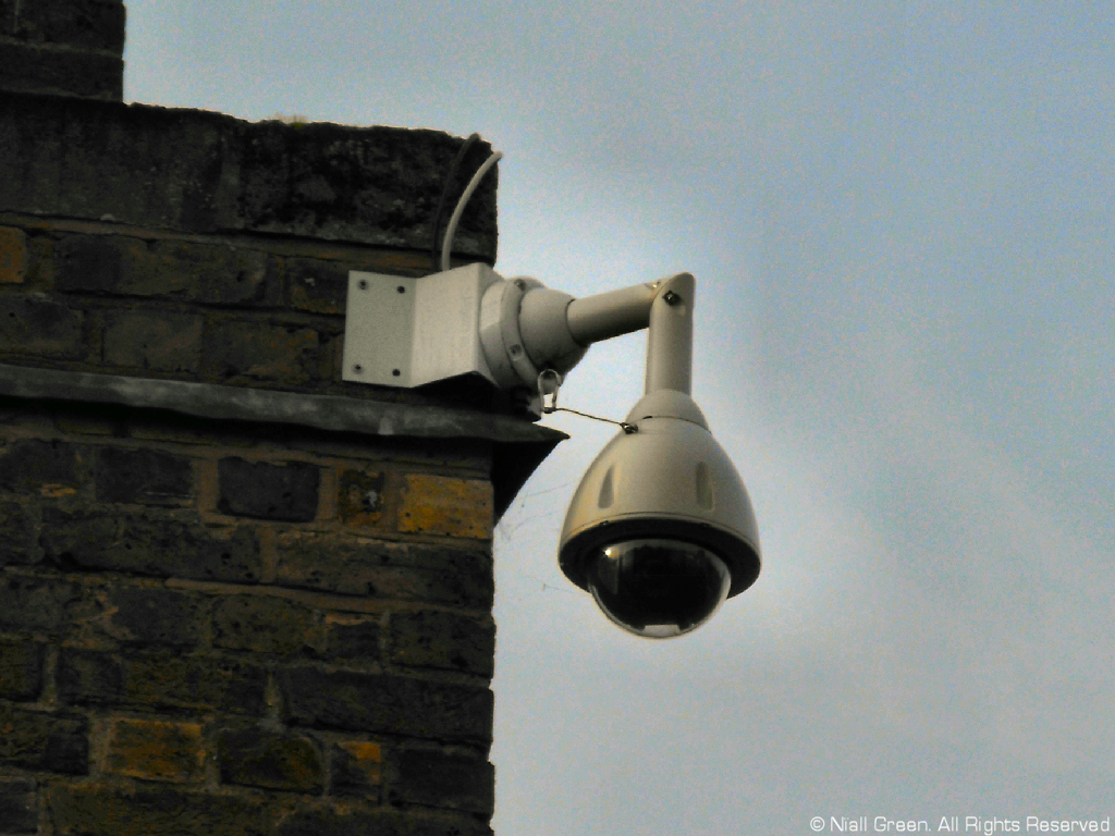 A dome camera on a building.