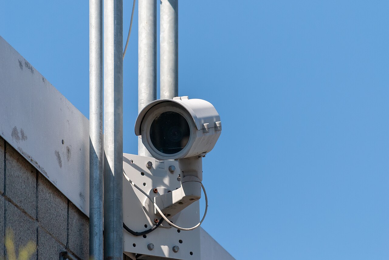 A security camera watching over a street.